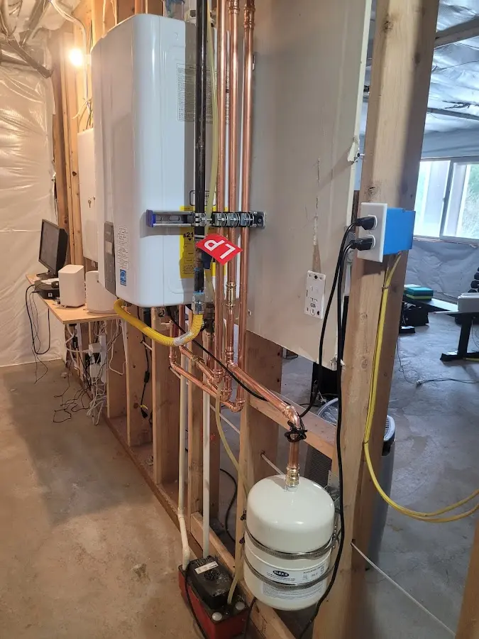 Licensed plumber repairing a kitchen sink in North Plainfield